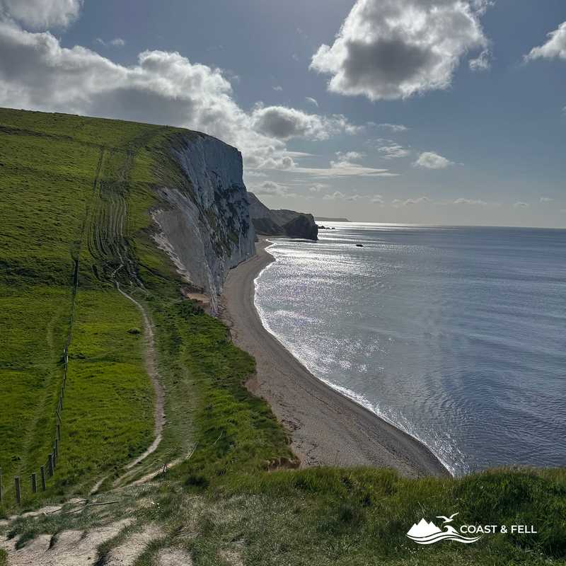 Durdle Door and Man o War Bay from the coast path in morning sun