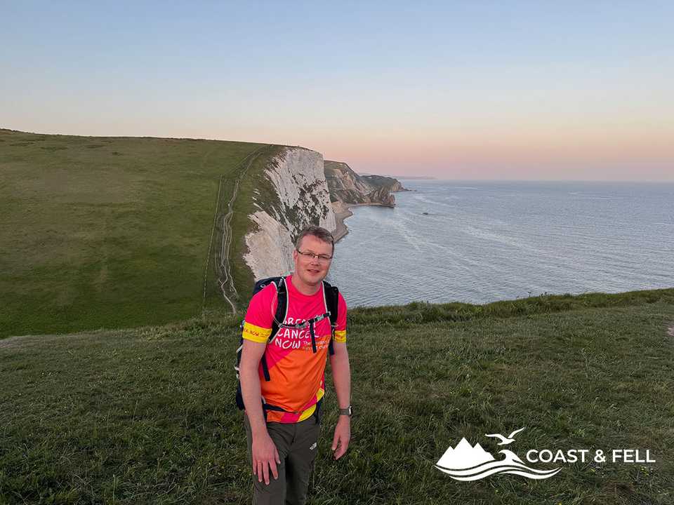 Shane on the Jurassic Coast cliffs during the Ultra Challenge at dawn, Dorset