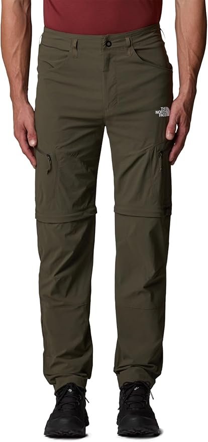 The North Face Exploration Convertible Pants in khaki on trail with zip-off leg and stretch panels visible