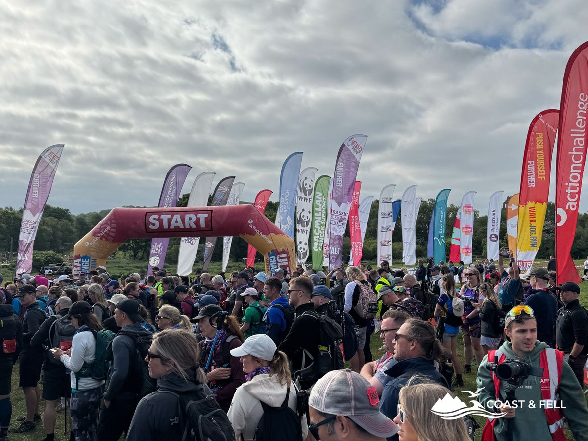 Jurassic Coast Ultra Challenge start pen crowds charity flags and START arch