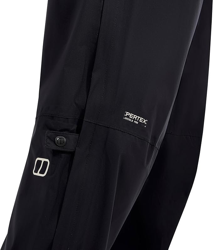 Berghaus Paclite Gore-Tex overtrousers in black packed into mesh stuff sack showing compact size