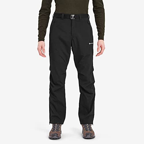 Montane Terra Pants in black, worn with the webbing belt fastened, zipped hand pockets visible