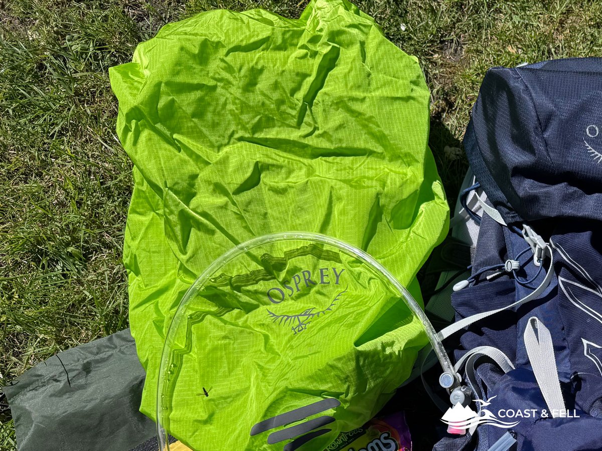 Osprey Talon 33 rain cover laid out alongside the pack