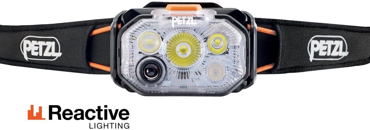 Petzl Swift RL reactive head torch showing the front ambient-light sensor and LED array